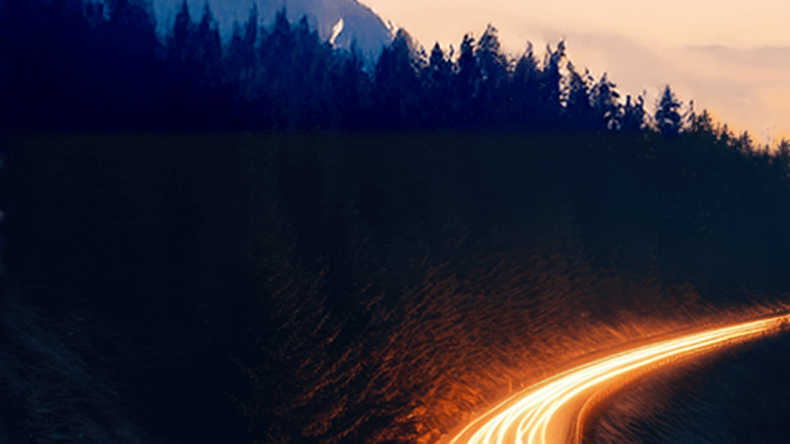 Lit up highway in the mountains