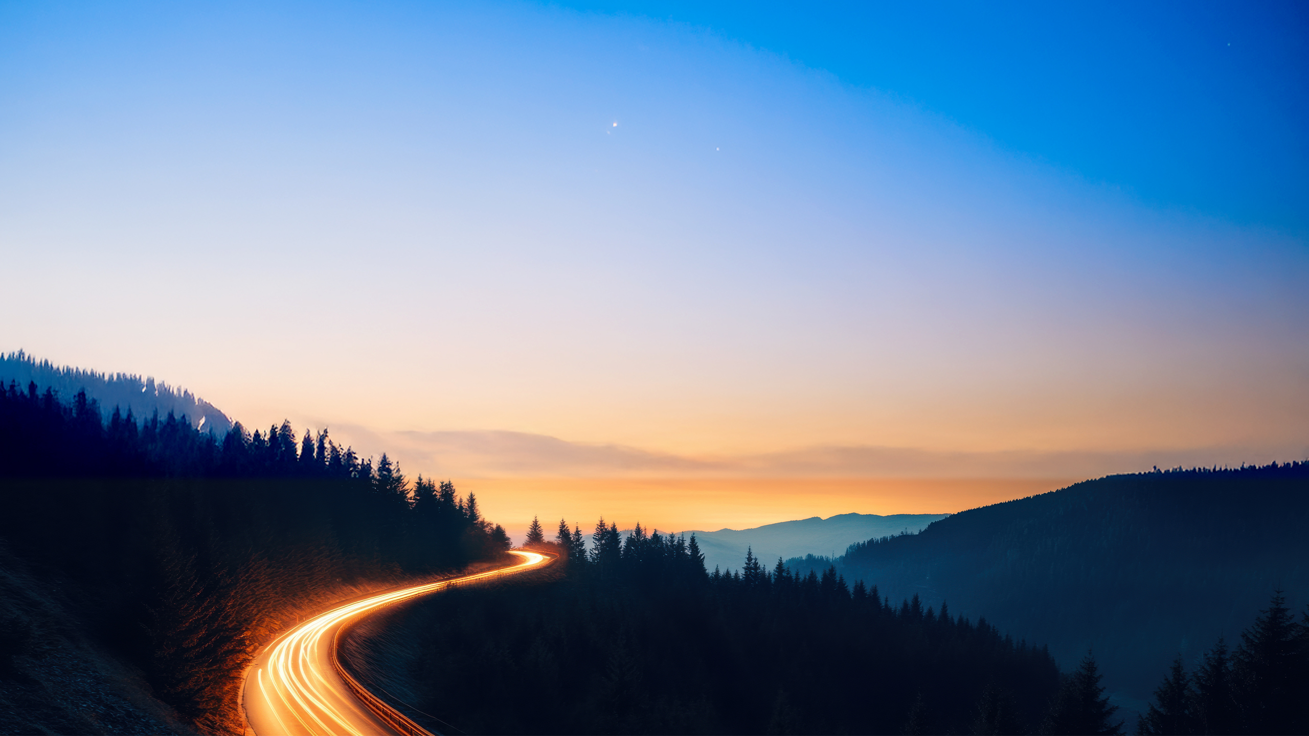 Lit up highway in the mountains